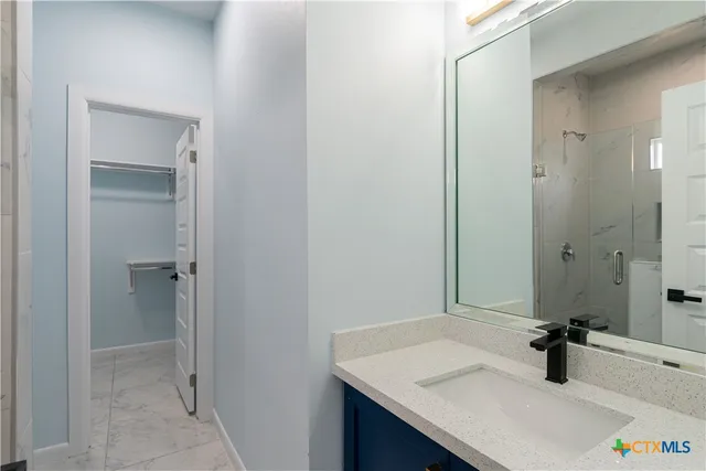 a bathroom with a sink and a mirror