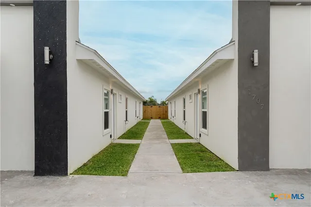a view of house with yard