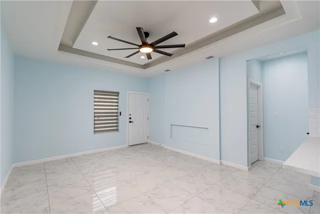 a view of an empty room with a window