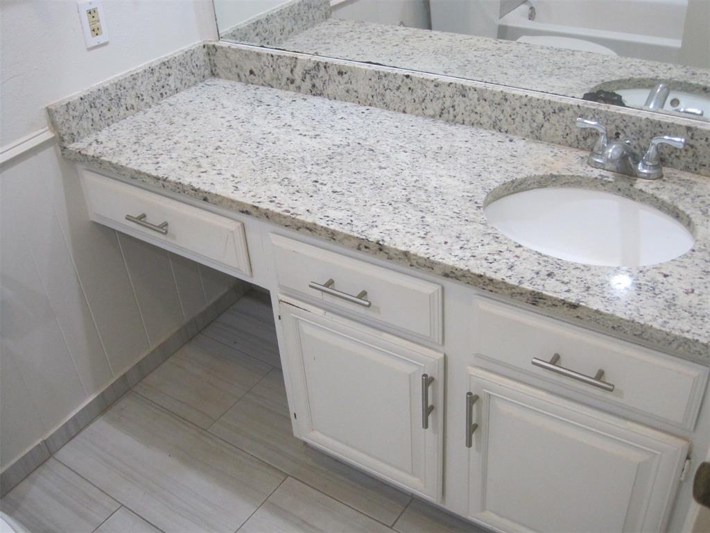 6478 Argo Street Dallas, TX 75214 - Photo 11 of 15 a bathroom with a sink and vanity