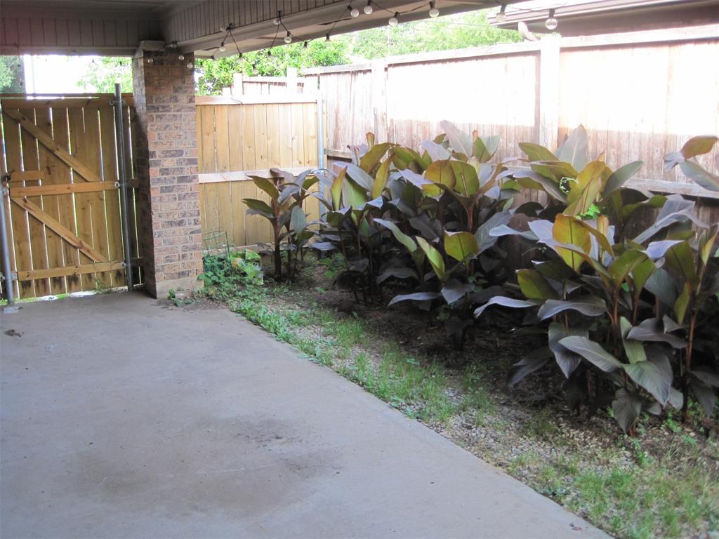 6478 Argo Street Dallas, TX 75214 - Photo 14 of 15 a backyard of a house with lots of green space