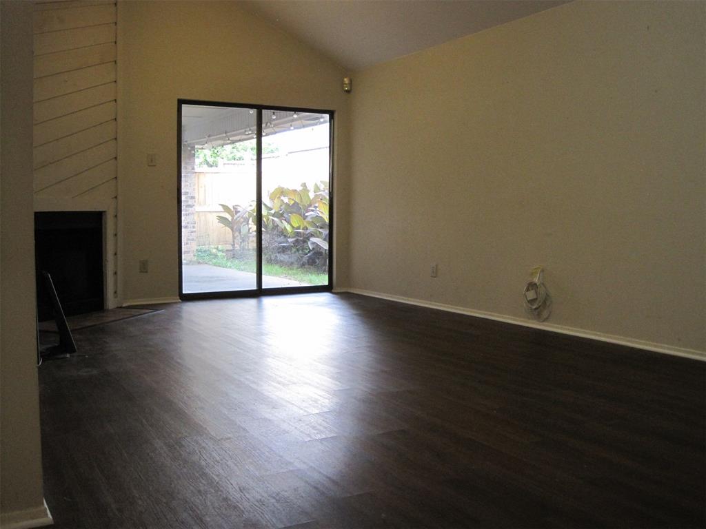 6478 Argo Street Dallas, TX 75214 - Photo 3 of 15 a view of a livingroom with wooden floor and a window