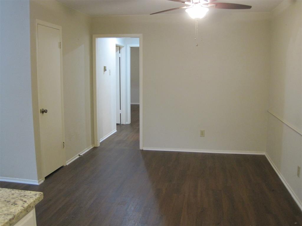 6478 Argo Street Dallas, TX 75214 - Photo 7 of 15 an empty room with wooden floor and windows
