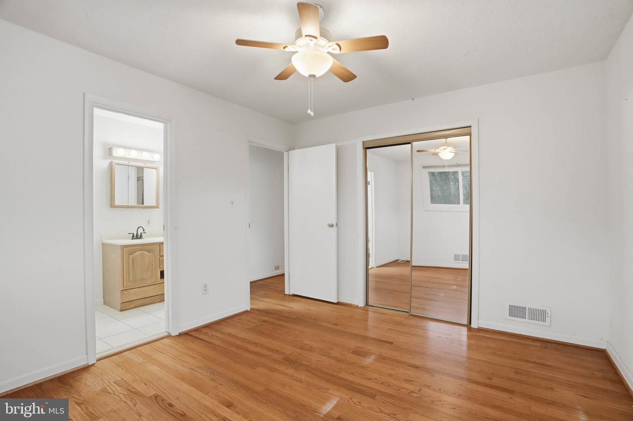1909 Pagham Road Glen Burnie, MD 21061 - Photo 16 of 30 a view of empty room with wooden floor