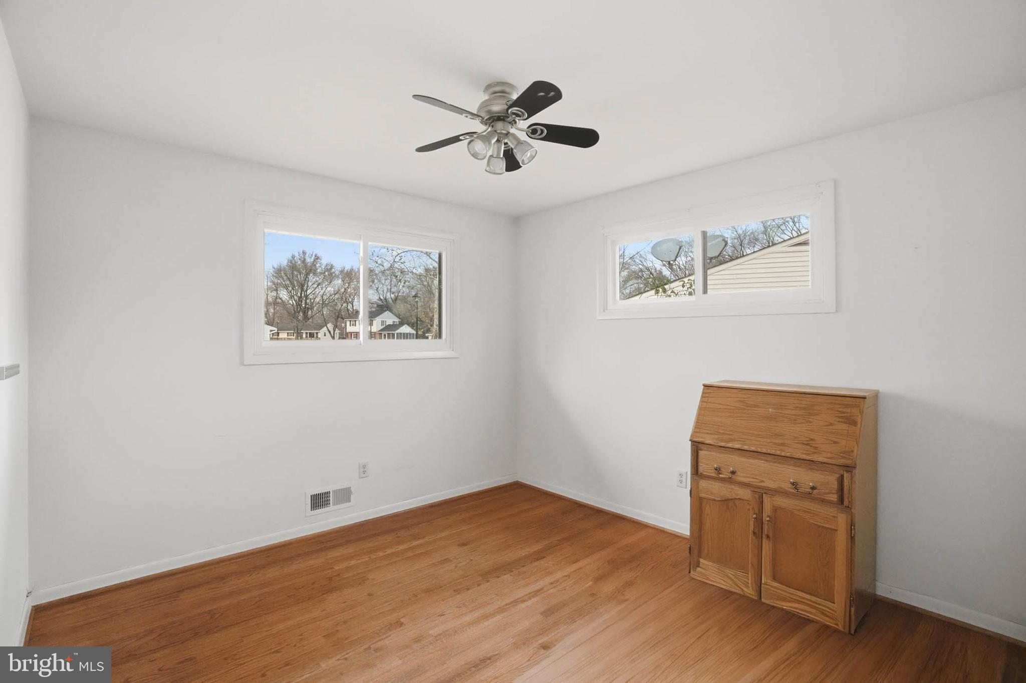 1909 Pagham Road Glen Burnie, MD 21061 - Photo 18 of 30 a view of room with hardwood floor and cabinet