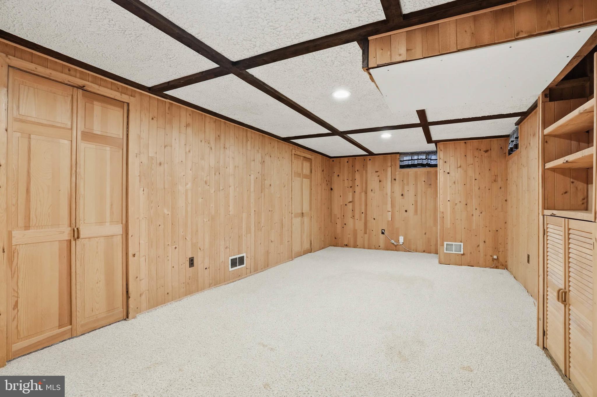 1909 Pagham Road Glen Burnie, MD 21061 - Photo 22 of 30 a view of a room with a white walls and wooden walls
