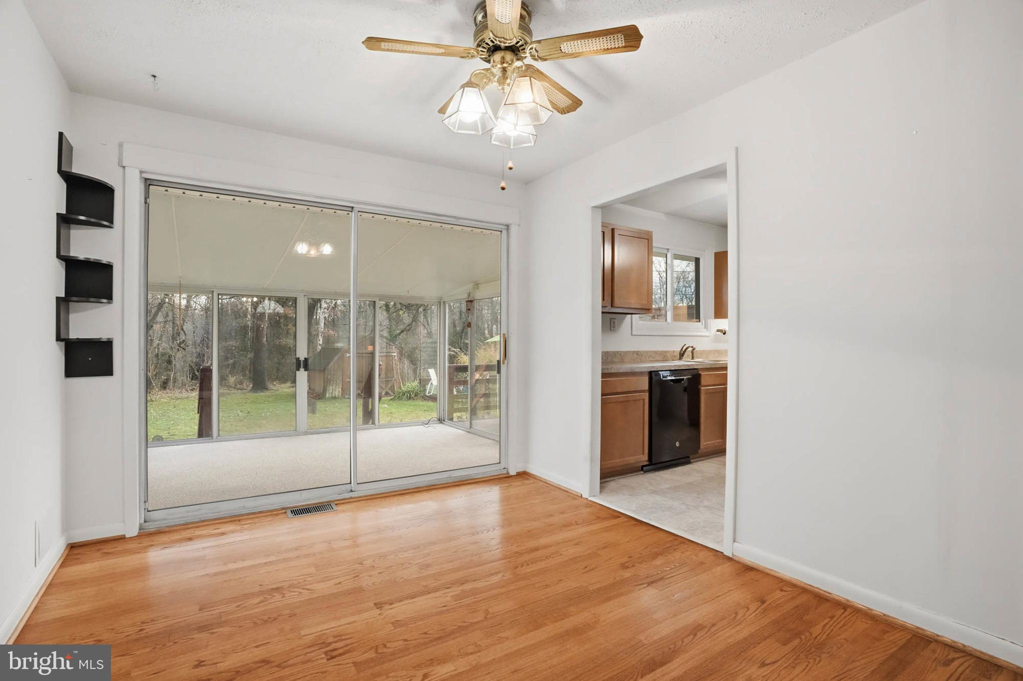 1909 Pagham Road Glen Burnie, MD 21061 - Photo 7 of 30 a view of an empty room with window and chandelier