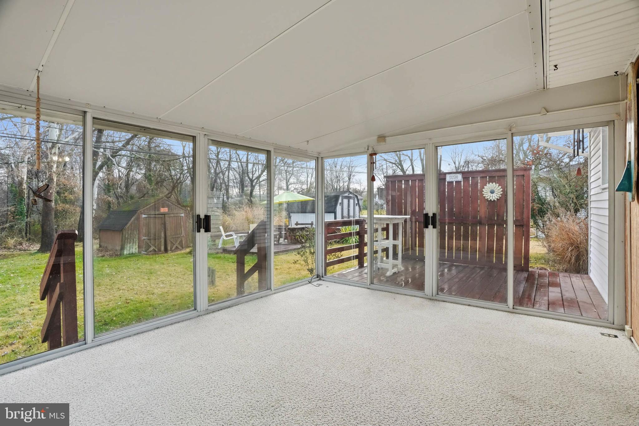 1909 Pagham Road Glen Burnie, MD 21061 - Photo 9 of 30 a view of empty room with floor to ceiling windows and yard