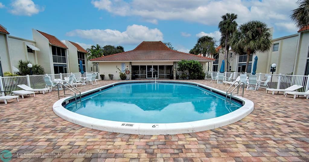 1428 Southeast 4th Avenue, Unit 169 Deerfield Beach, FL 33441 - Photo 1 of 16 a view of outdoor space yard swimming pool and porch