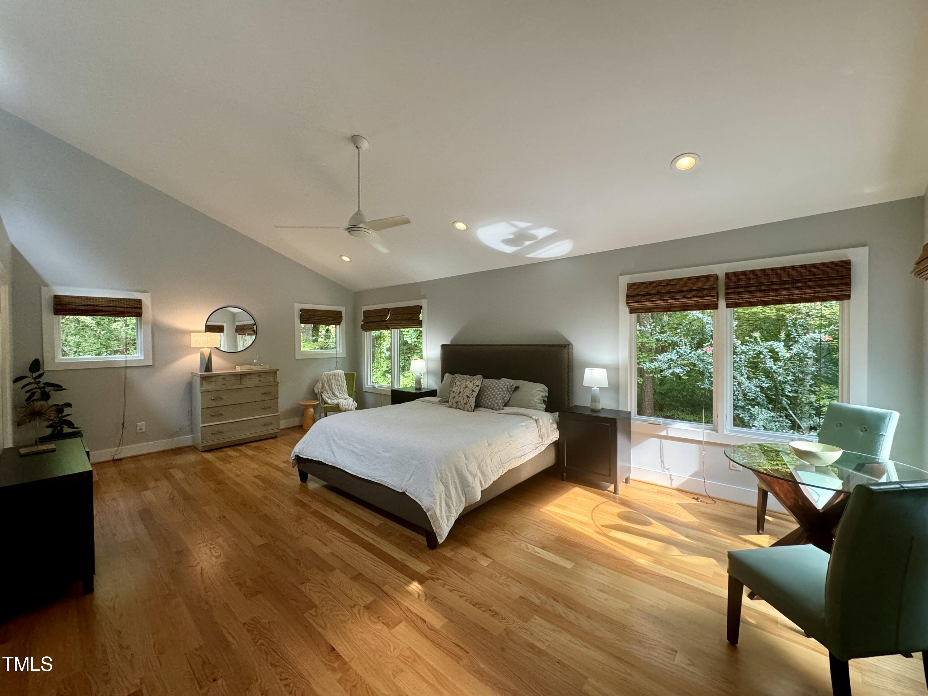 11904 Deer Run Raleigh, NC 27614 - Photo 14 of 61 a spacious bedroom with a bed window and table