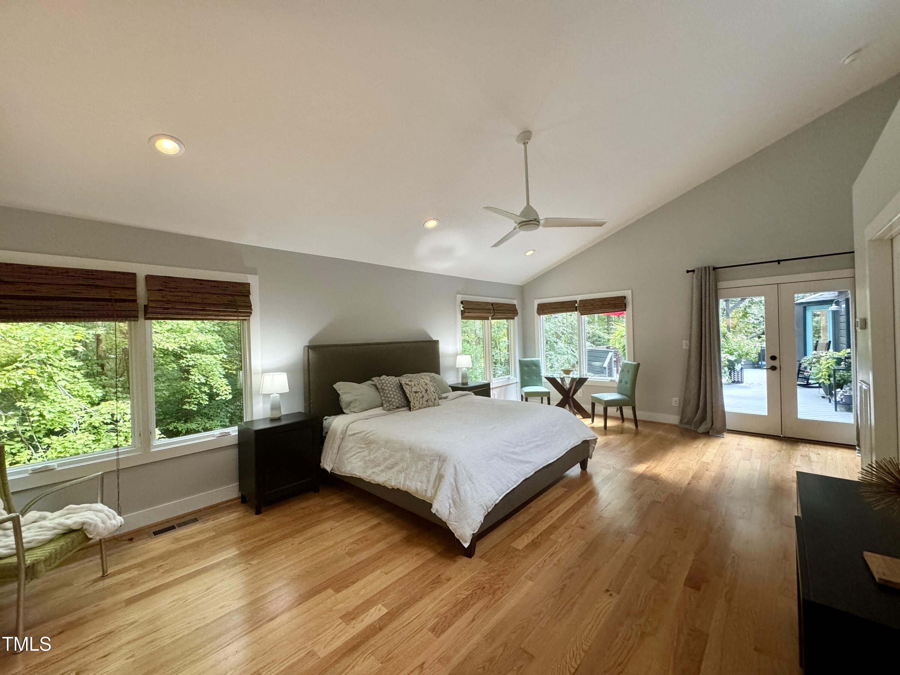 11904 Deer Run Raleigh, NC 27614 - Photo 17 of 61 a spacious bedroom with a large bed and a large window