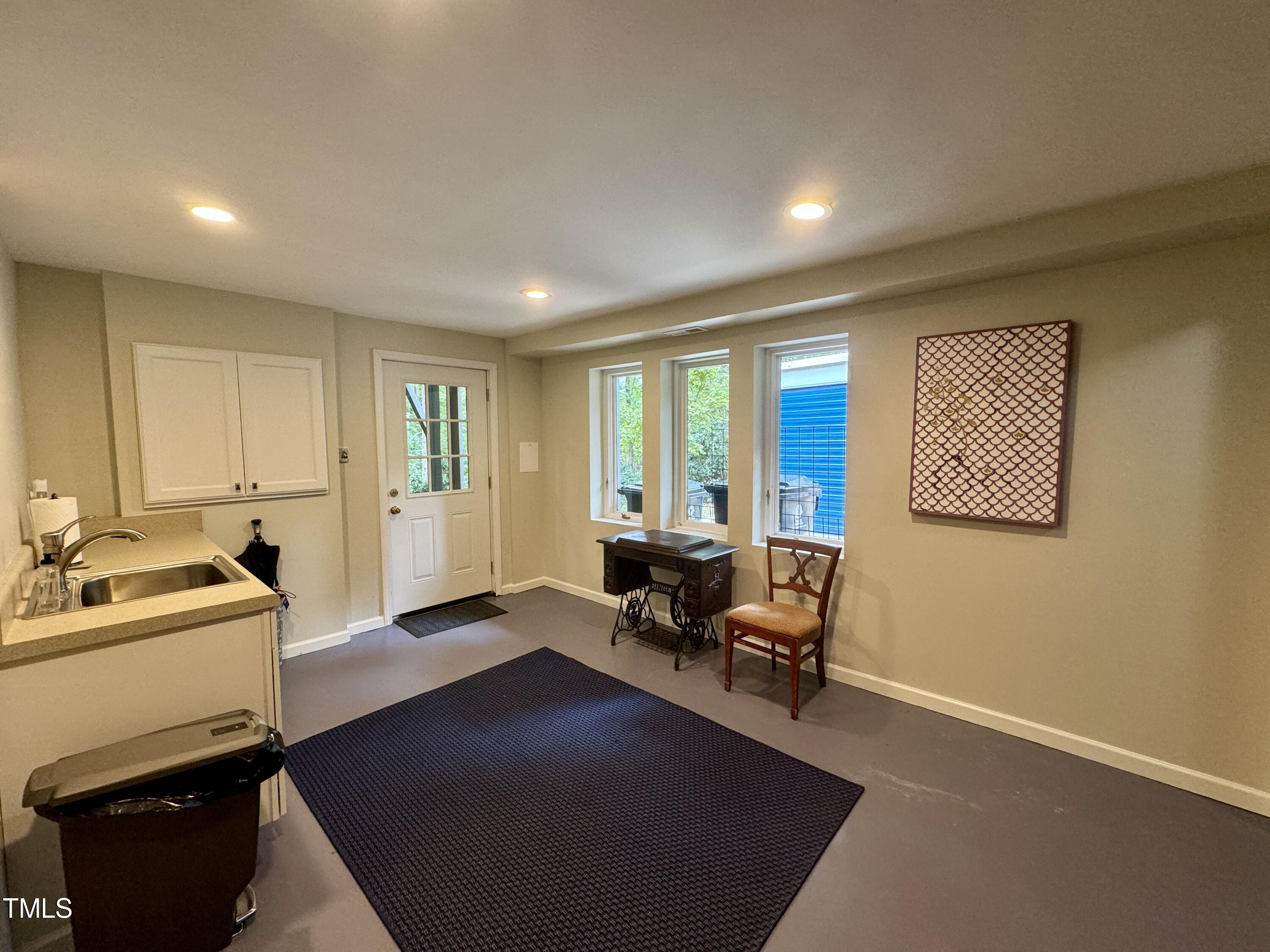 11904 Deer Run Raleigh, NC 27614 - Photo 30 of 61 a view of a livingroom with workspace and a couch