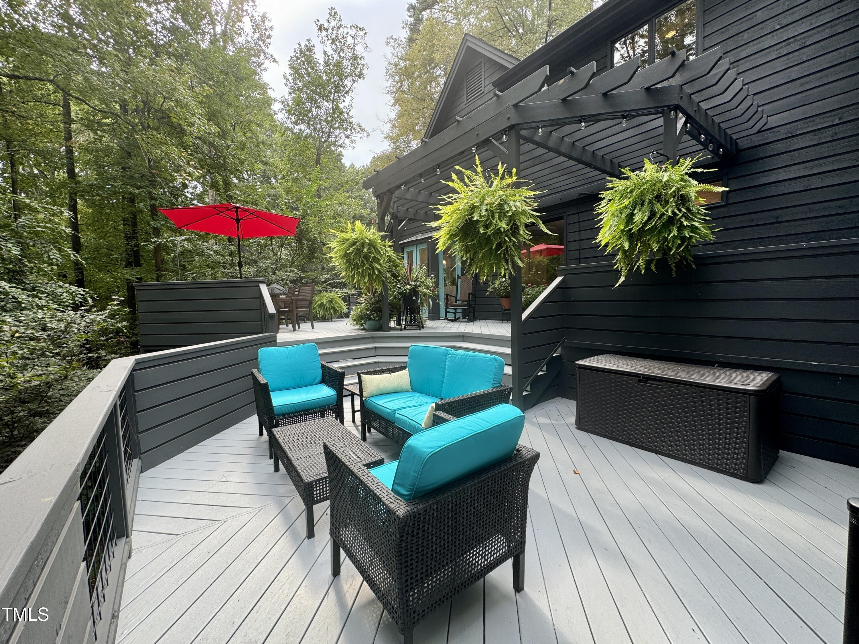 11904 Deer Run Raleigh, NC 27614 - Photo 42 of 61 a view of a chairs and table on the wooden roof deck