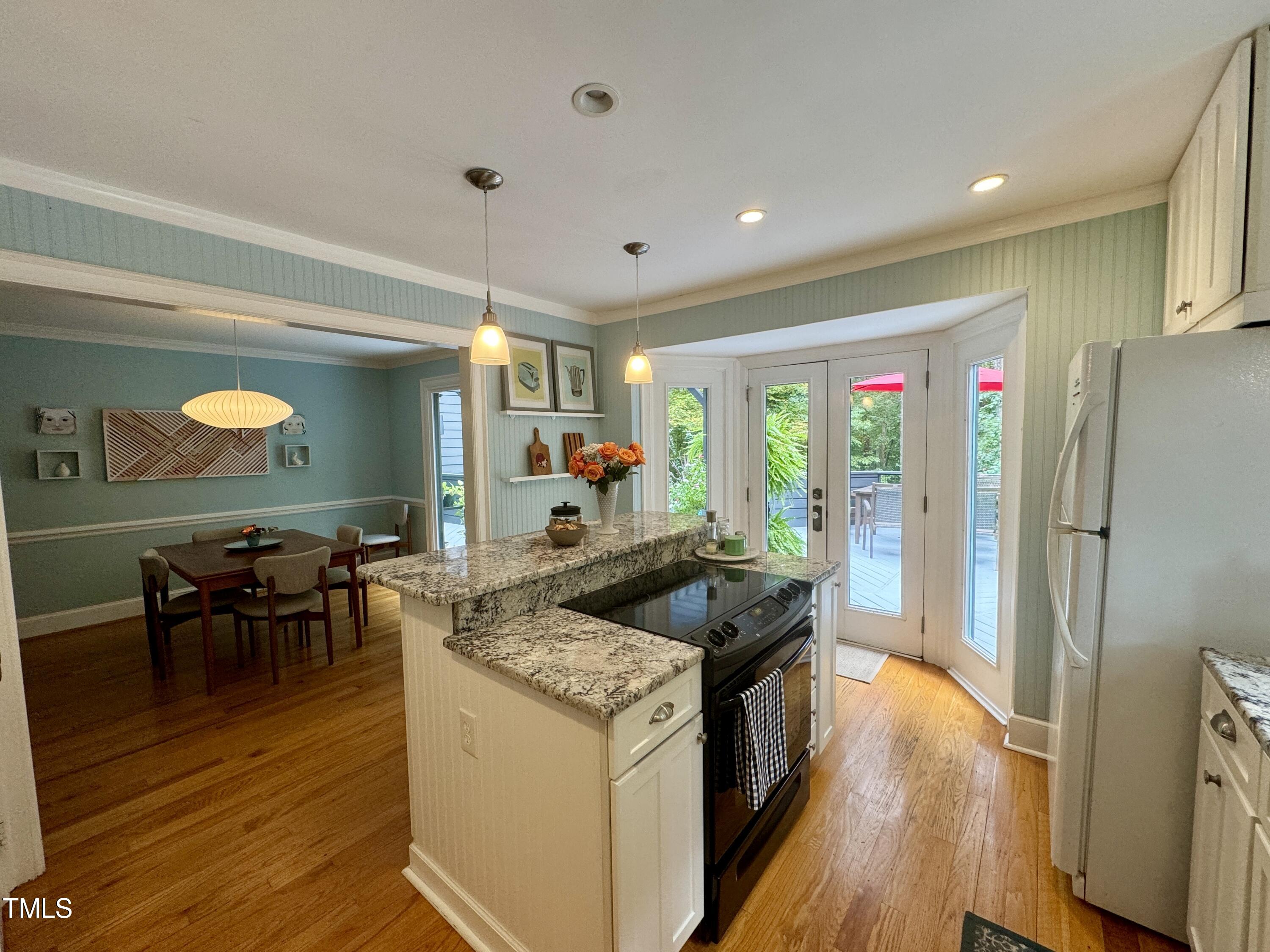 11904 Deer Run Raleigh, NC 27614 - Photo 8 of 61 a kitchen with stainless steel appliances granite countertop a sink and a refrigerator