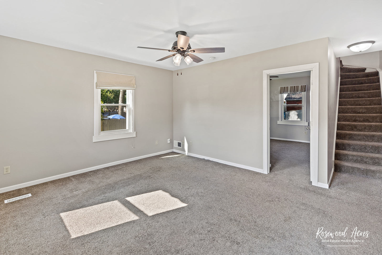 345 North 5th Avenue Kankakee, IL 60901 - Photo 5 of 22 an empty room with windows and ceiling fan