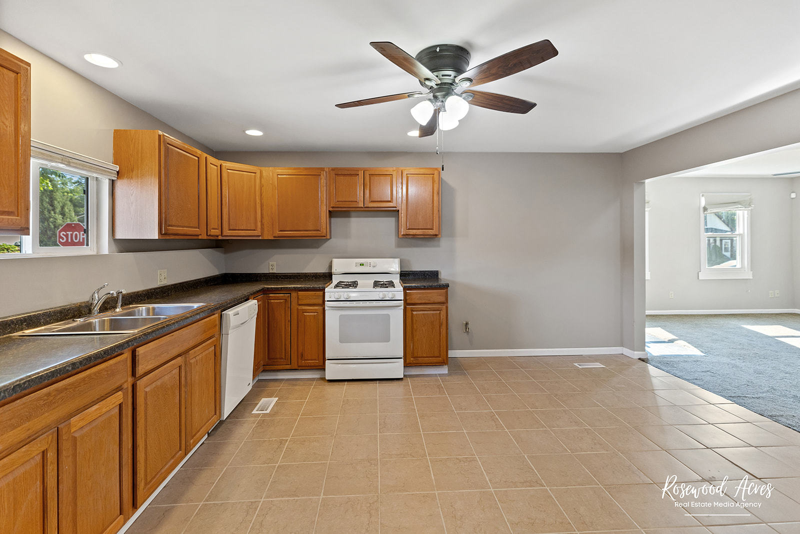 345 North 5th Avenue Kankakee, IL 60901 - Photo 7 of 22 a kitchen with stainless steel appliances granite countertop a stove a sink and a refrigerator