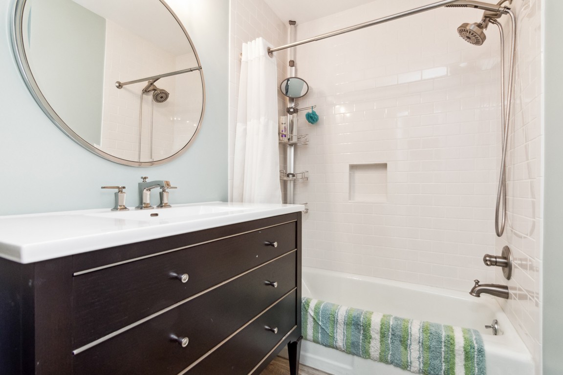 1241 General George Patton Road Nashville, TN 37221 - Photo 17 of 23 a bathroom with a double vanity sink mirror and shower