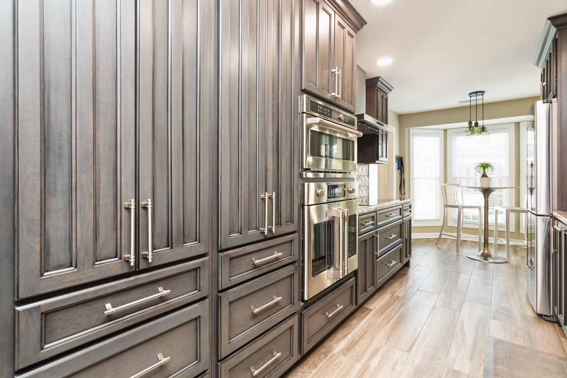 1241 General George Patton Road Nashville, TN 37221 - Photo 5 of 23 a kitchen with stainless steel appliances a refrigerator and wooden cabinets
