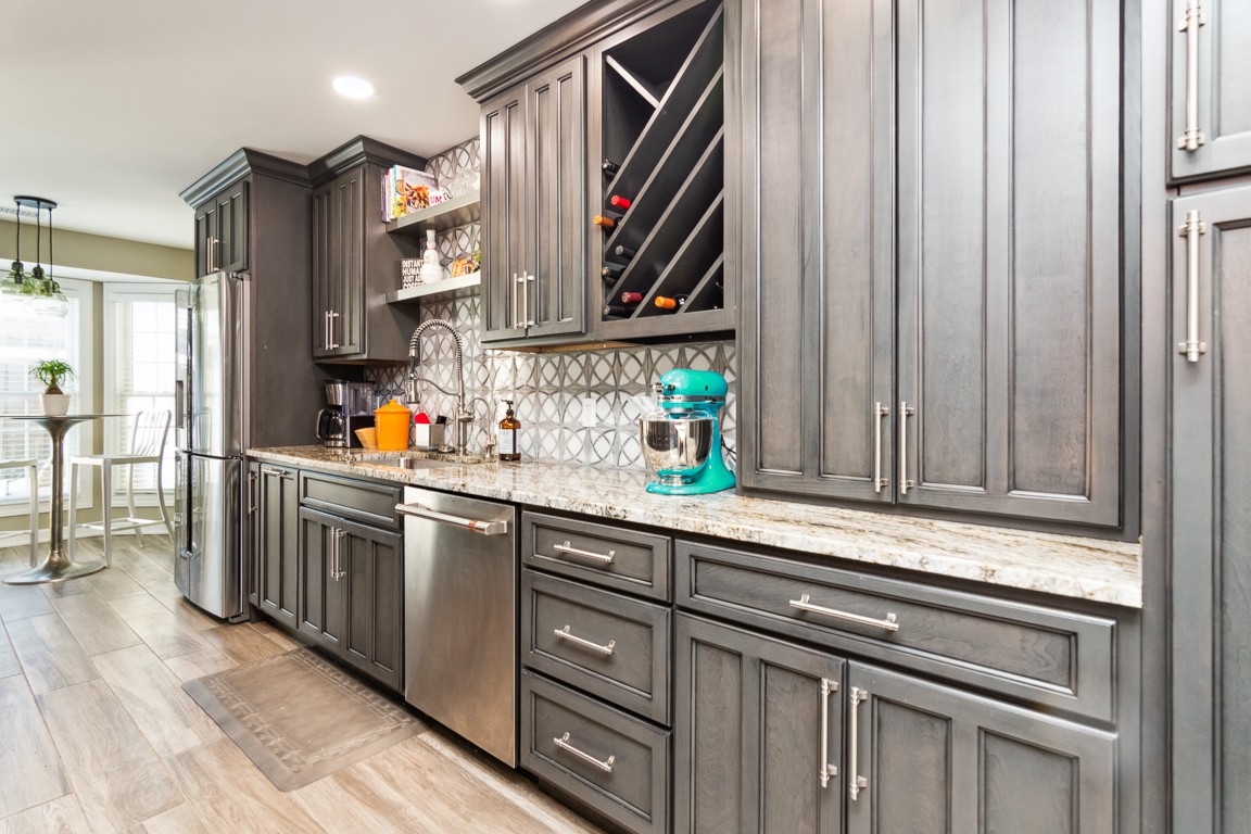1241 General George Patton Road Nashville, TN 37221 - Photo 6 of 23 a kitchen with stainless steel appliances granite countertop a sink and a cabinets