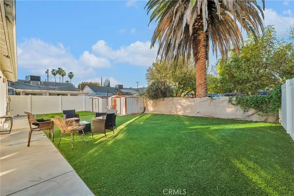 a view of a backyard with a garden and plants