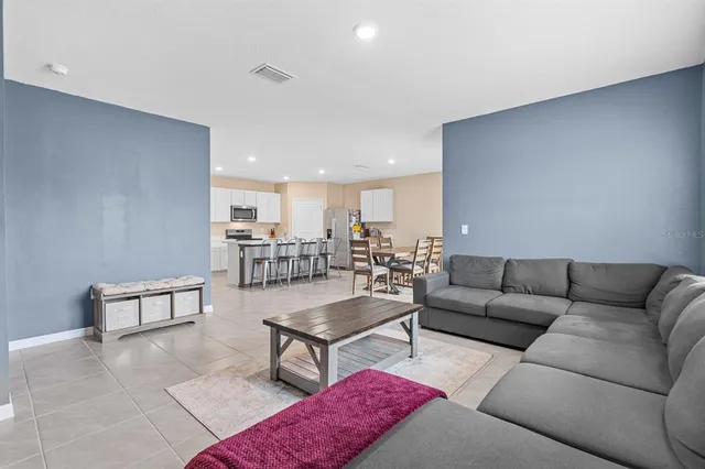 a living room with furniture and a window