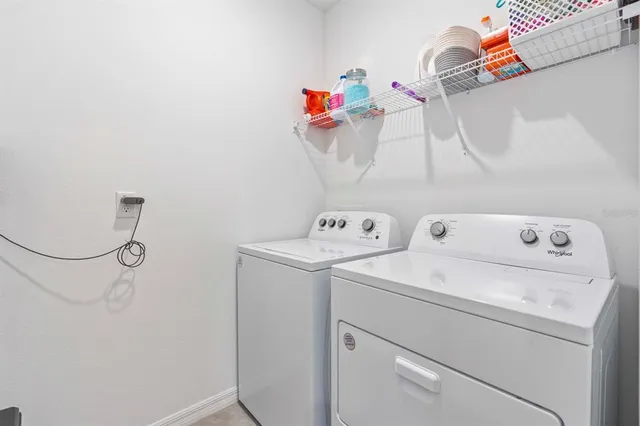 a bed sitting in a room next to a window