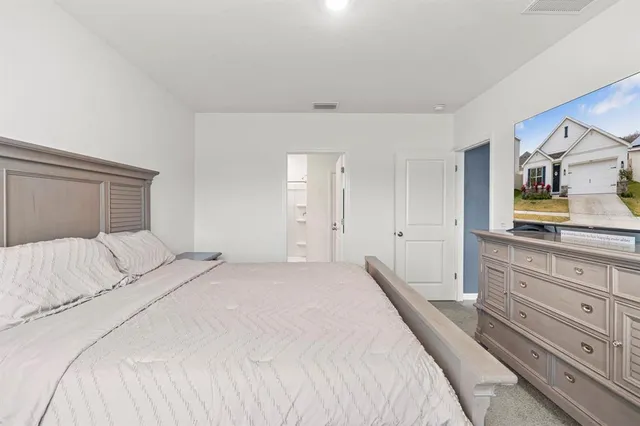 a bedroom with a bed and a cabinets