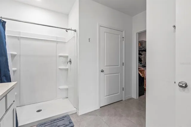 a view of a bathroom with a toilet sink and mirror