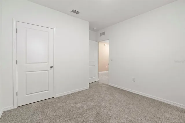 a view of a backyard with furniture