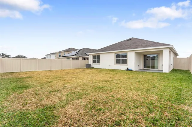 a view of swimming pool with outdoor seating and city view