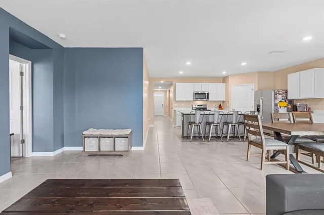 a kitchen with a sink stove and refrigerator