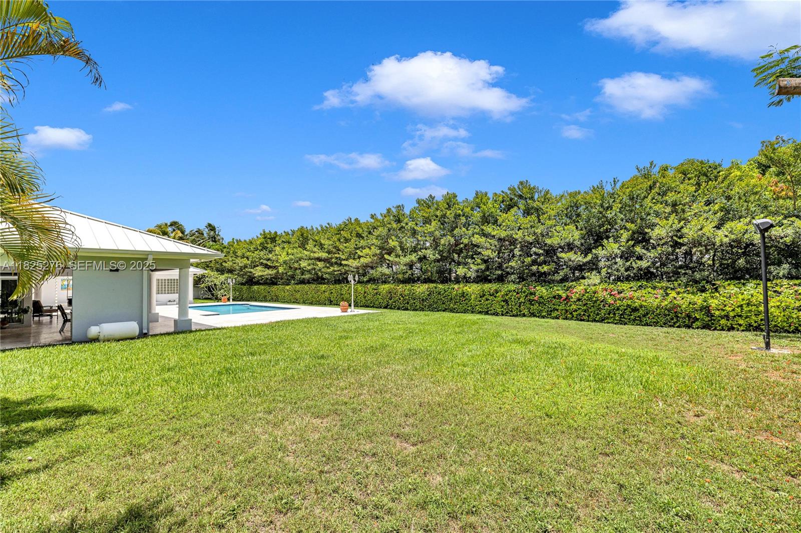 10563 Southwest 92nd Avenue Miami, FL 33176 - Photo 16 of 87 a view of a house with a big yard