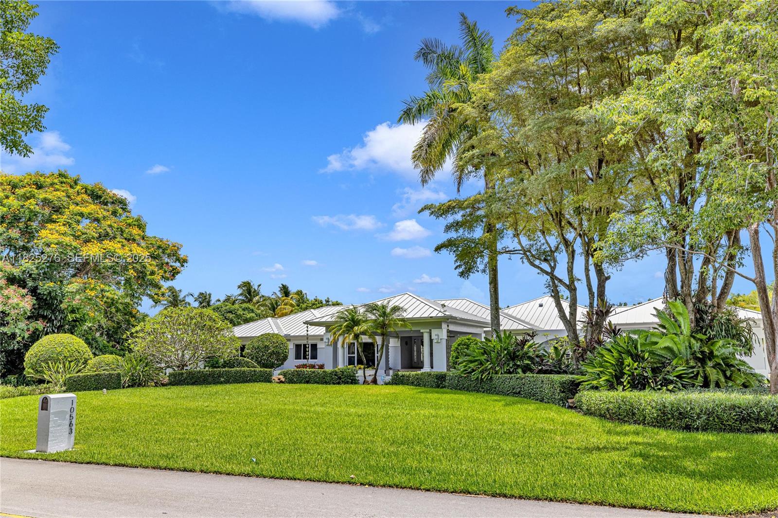 10563 Southwest 92nd Avenue Miami, FL 33176 - Photo 2 of 87 a front view of a house with a yard