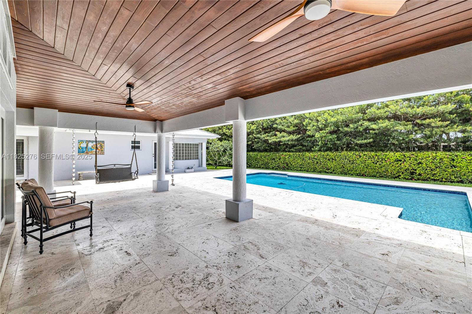 10563 Southwest 92nd Avenue Miami, FL 33176 - Photo 24 of 87 a view of a patio with table and chairs next to a yard