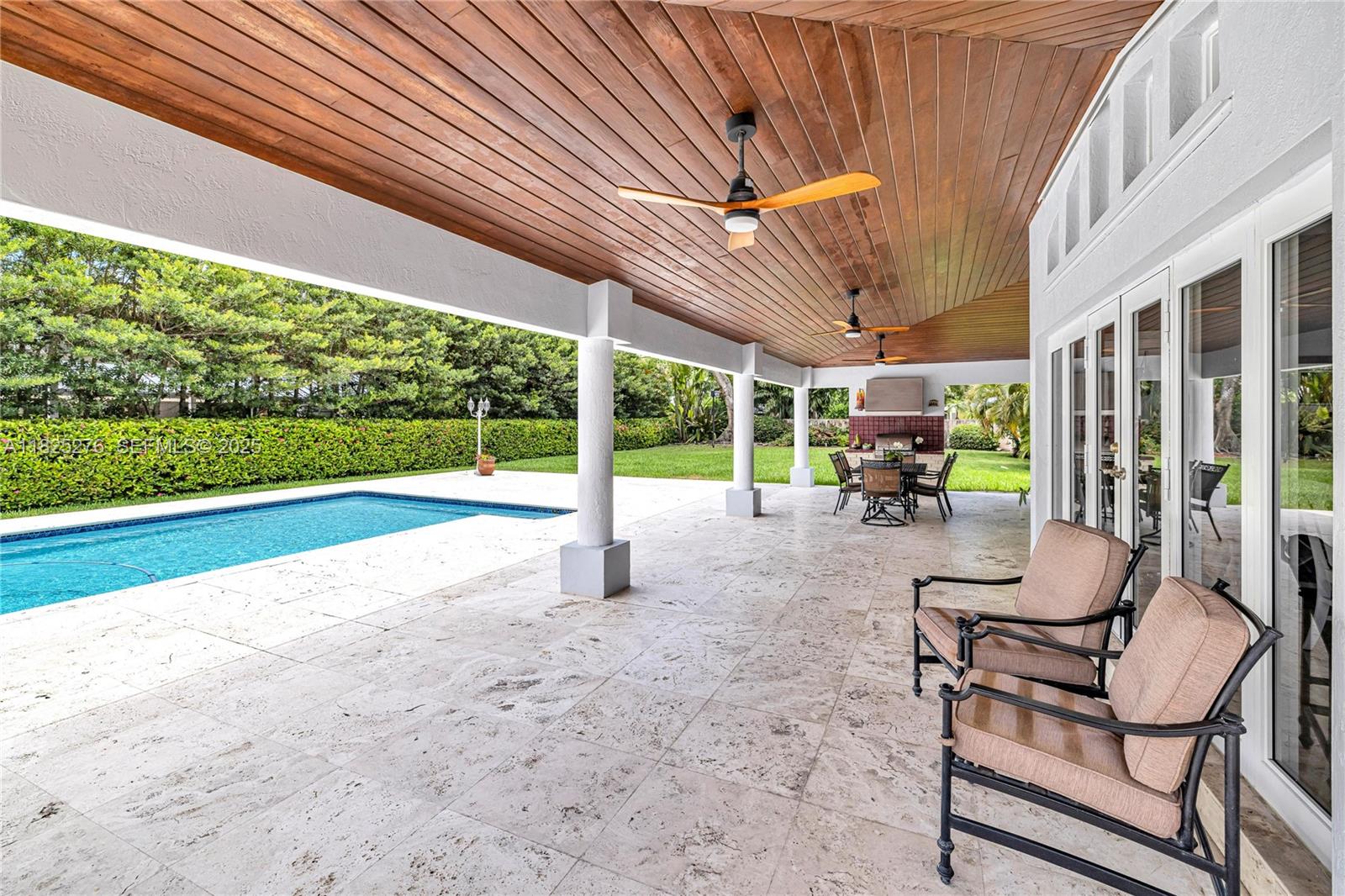 10563 Southwest 92nd Avenue Miami, FL 33176 - Photo 25 of 87 a view of a patio with table and chairs