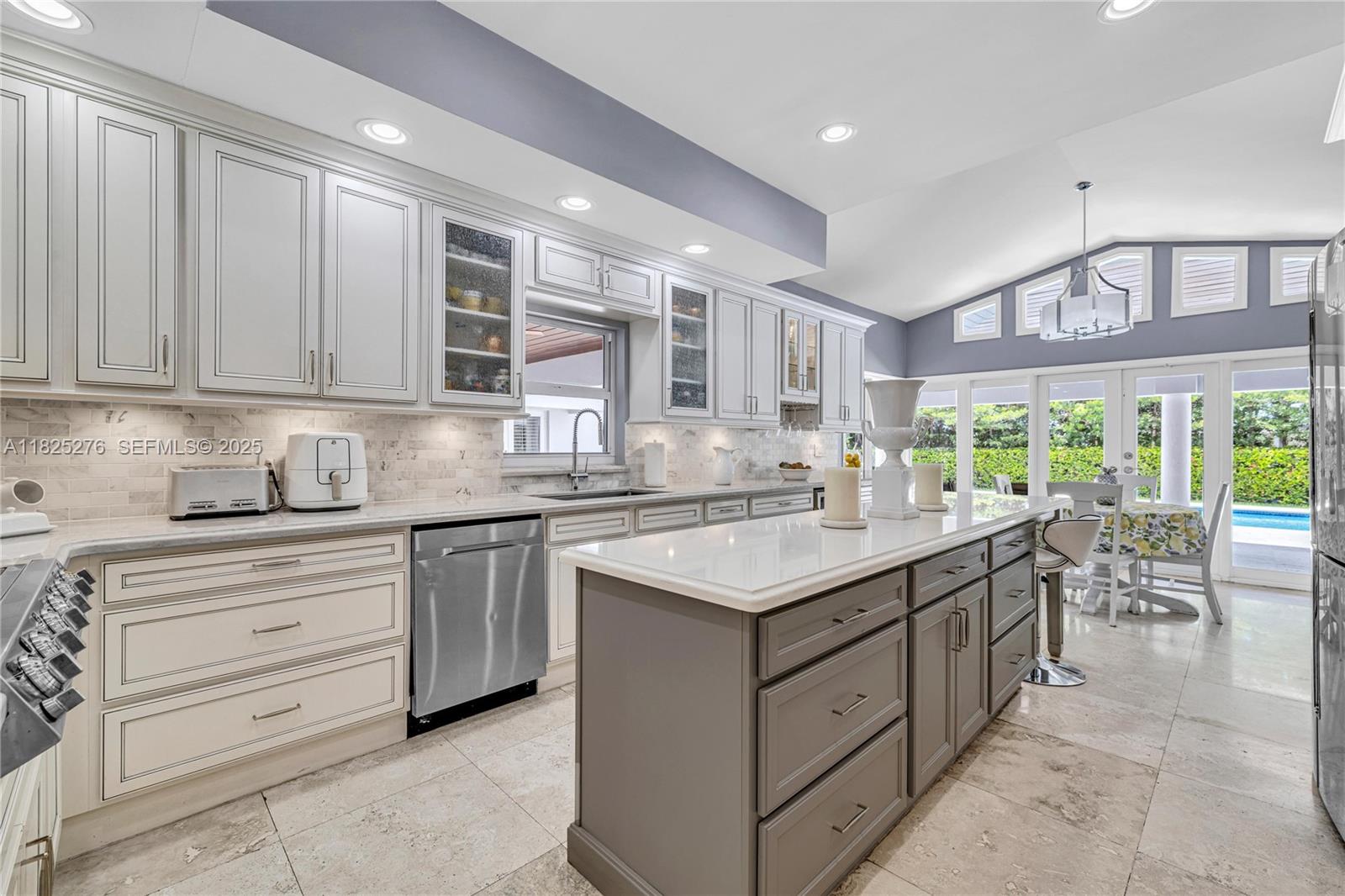 10563 Southwest 92nd Avenue Miami, FL 33176 - Photo 28 of 87 a kitchen with a sink stove and cabinets
