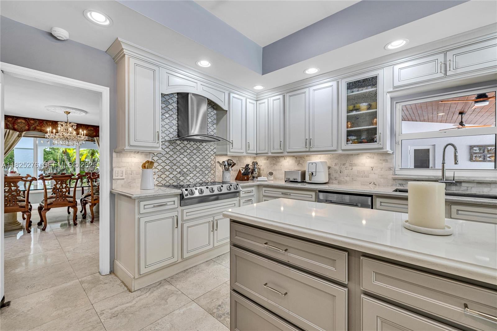 10563 Southwest 92nd Avenue Miami, FL 33176 - Photo 30 of 87 a kitchen with kitchen island granite countertop a sink stainless steel appliances and cabinets