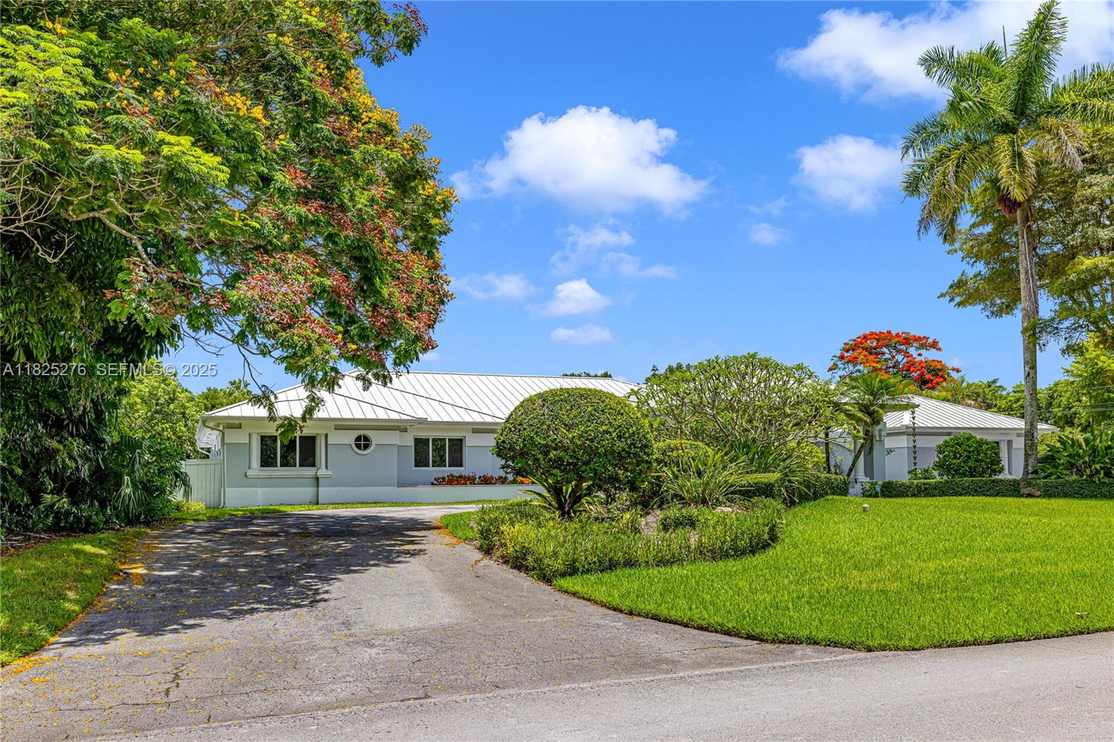 10563 Southwest 92nd Avenue Miami, FL 33176 - Photo 3 of 87 a front view of a house with a yard