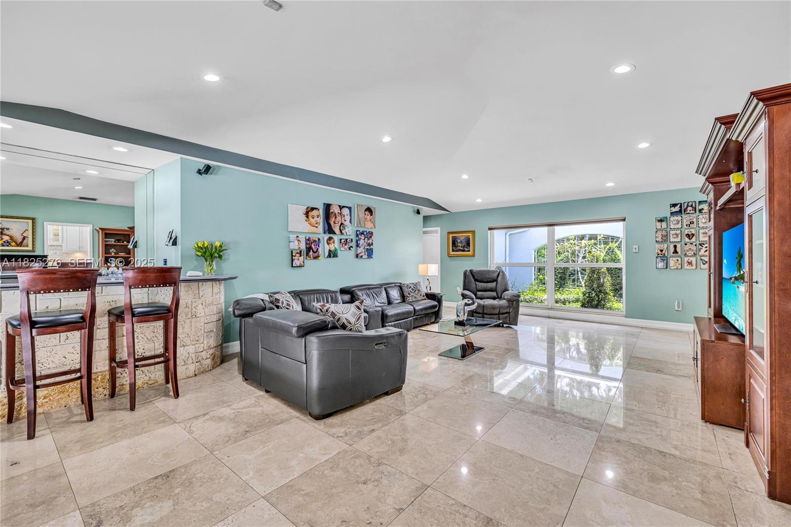 10563 Southwest 92nd Avenue Miami, FL 33176 - Photo 43 of 87 a living room with furniture and a flat screen tv