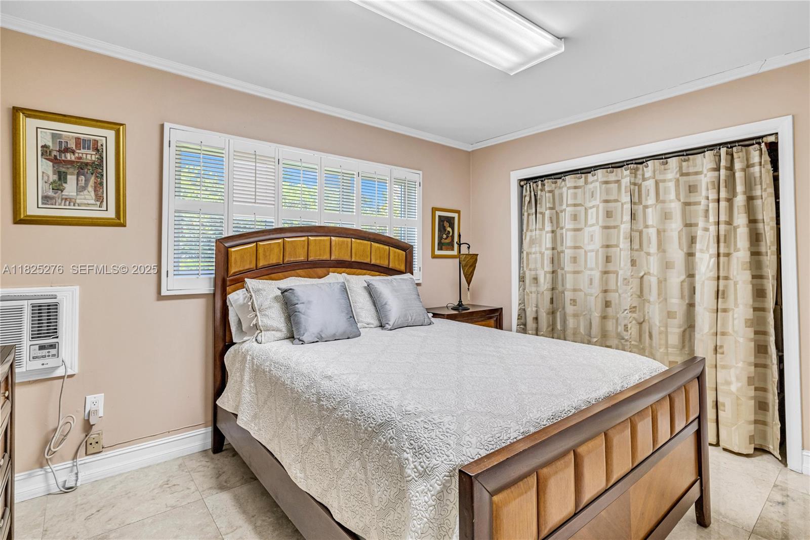 10563 Southwest 92nd Avenue Miami, FL 33176 - Photo 47 of 87 a bedroom with a bed and a window