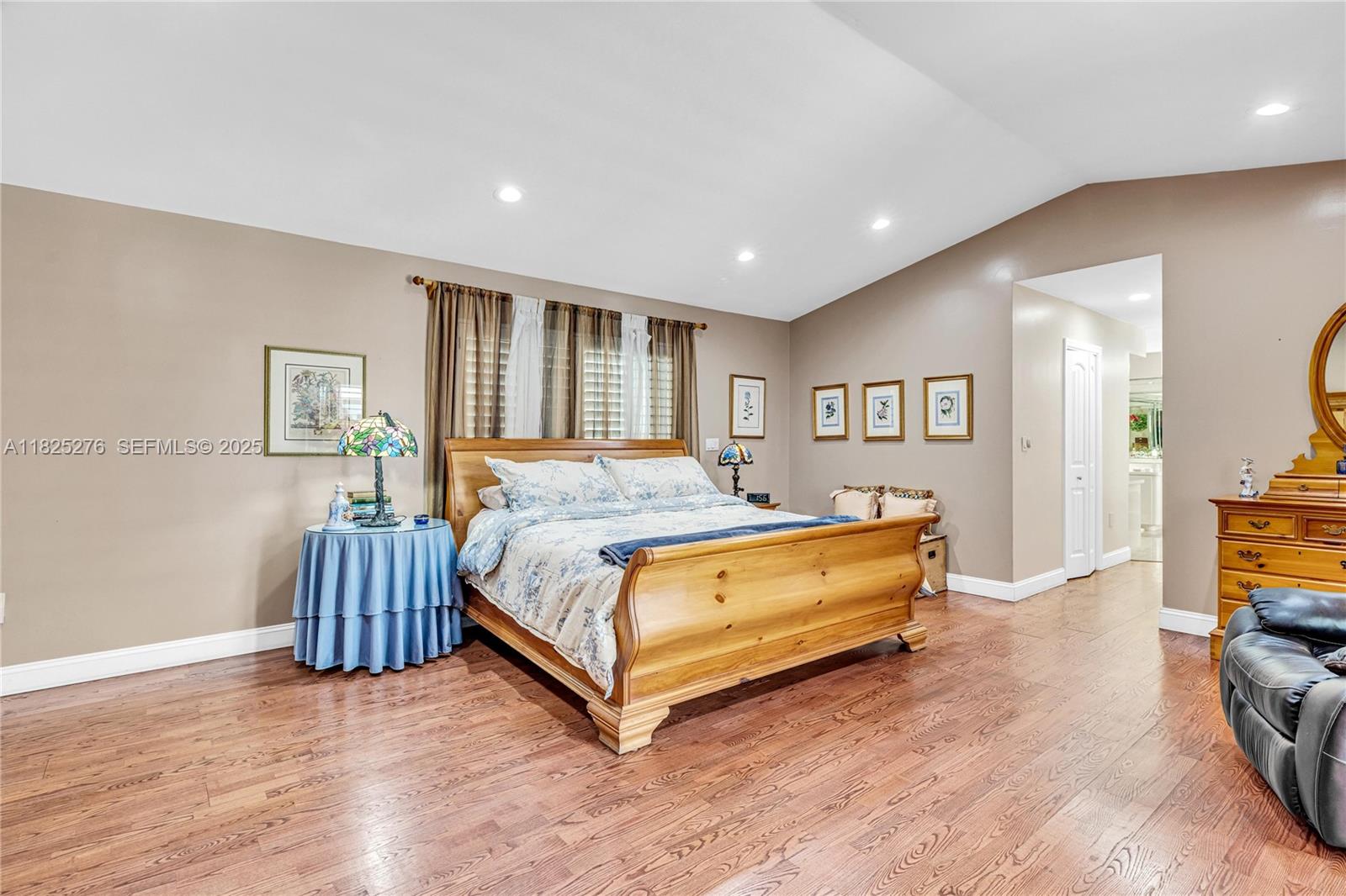 10563 Southwest 92nd Avenue Miami, FL 33176 - Photo 53 of 87 a spacious bedroom with a bed and a couch