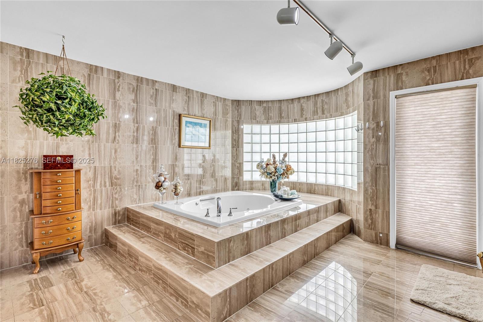 10563 Southwest 92nd Avenue Miami, FL 33176 - Photo 55 of 87 a spacious bedroom with a bed and a window