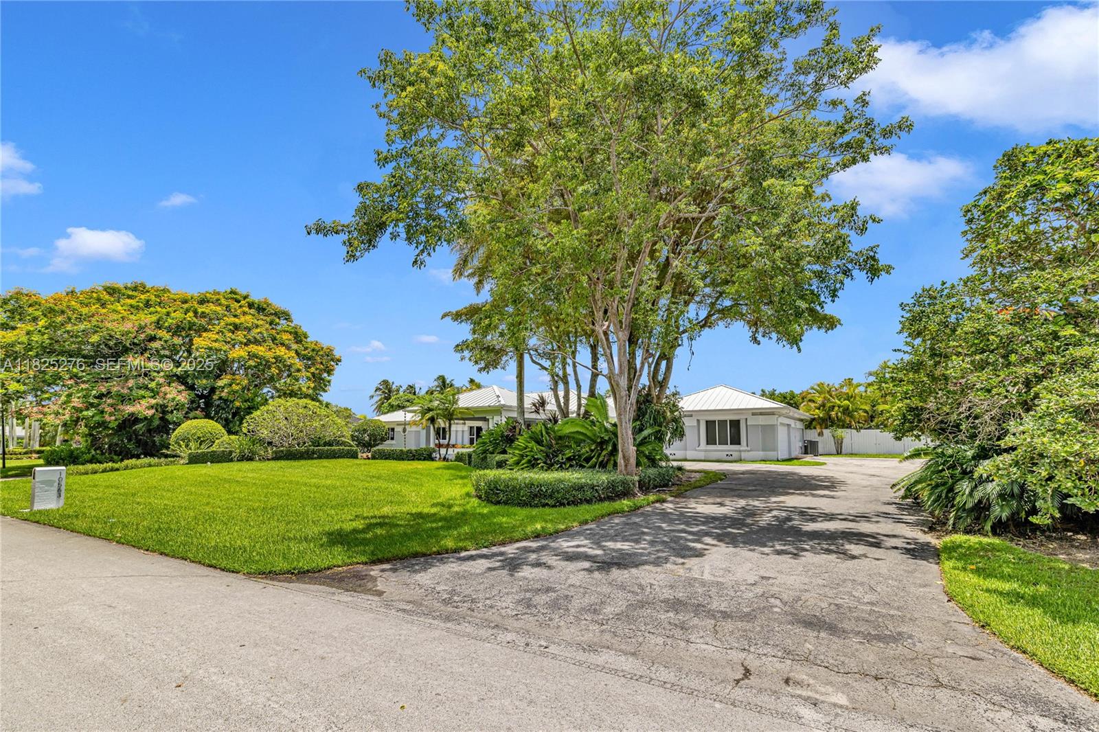 10563 Southwest 92nd Avenue Miami, FL 33176 - Photo 60 of 87 a view of a house with a big yard and large trees