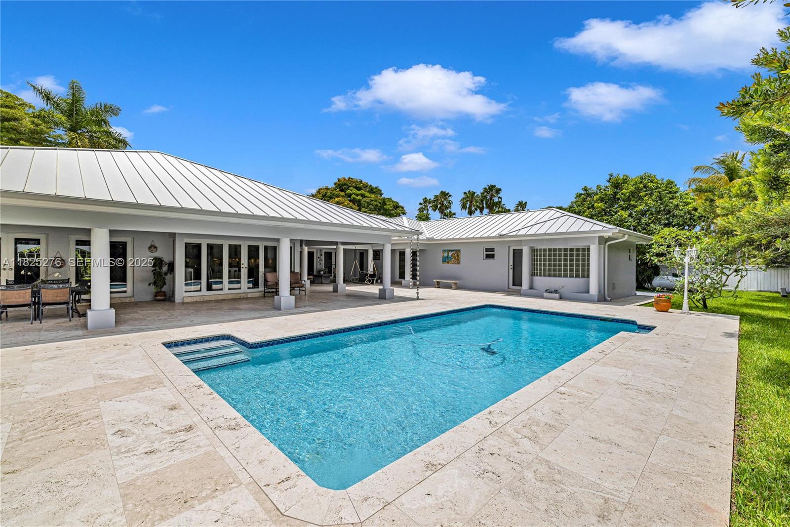 10563 Southwest 92nd Avenue Miami, FL 33176 - Photo 7 of 87 a view of a house with swimming pool and a chairs
