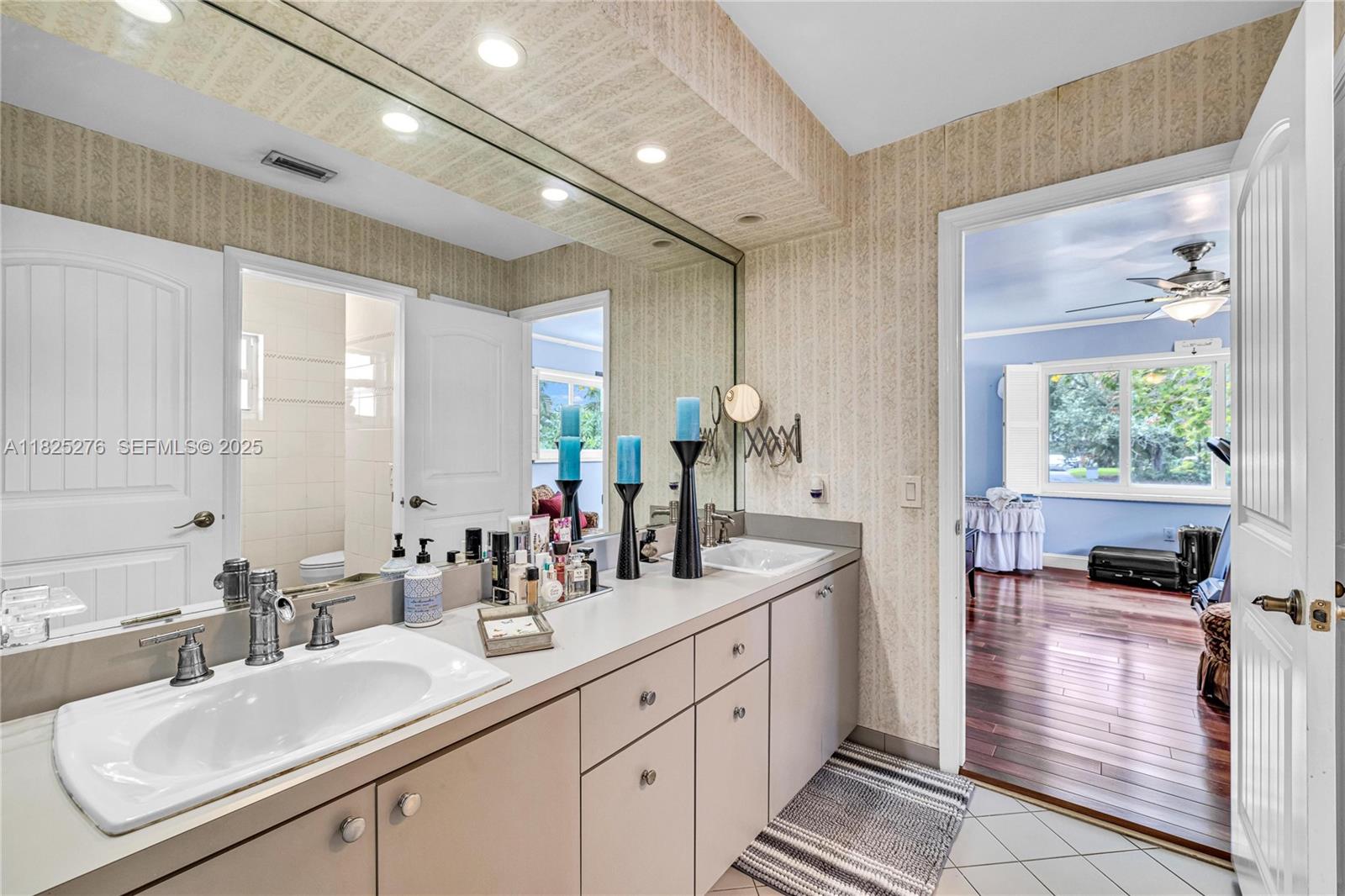 10563 Southwest 92nd Avenue Miami, FL 33176 - Photo 72 of 87 a bathroom with a double vanity sink and a mirror