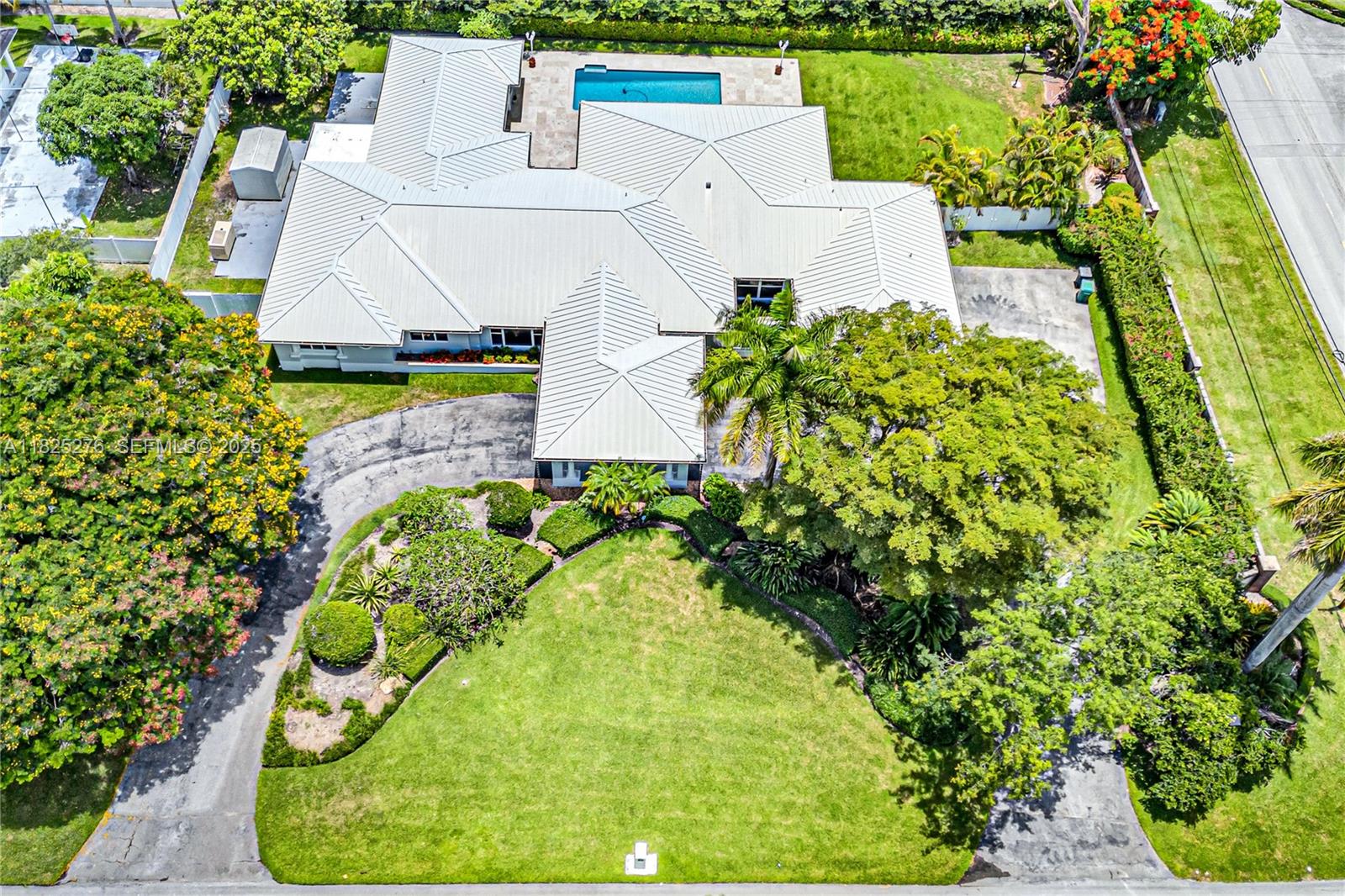 10563 Southwest 92nd Avenue Miami, FL 33176 - Photo 74 of 87 an aerial view of a house with a yard and a large pool