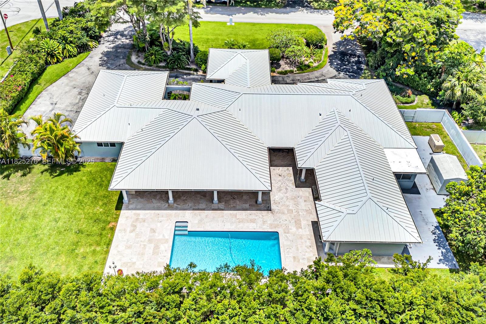 10563 Southwest 92nd Avenue Miami, FL 33176 - Photo 83 of 87 an aerial view of a house with swimming pool and big yard