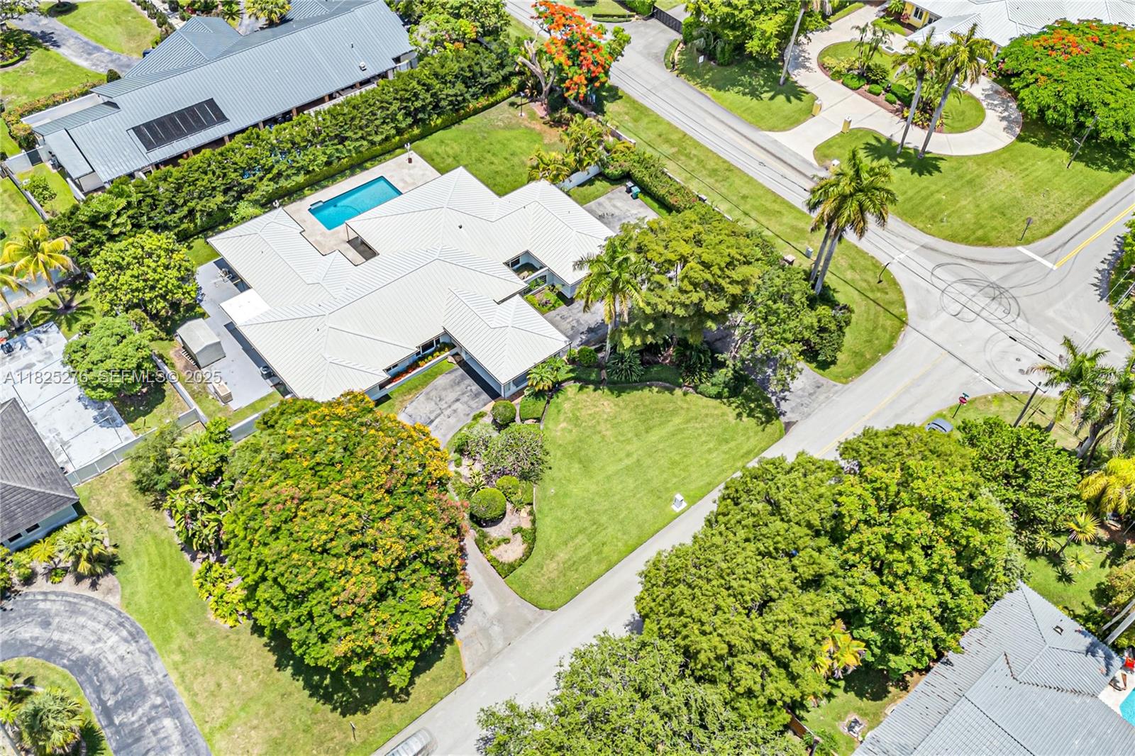 10563 Southwest 92nd Avenue Miami, FL 33176 - Photo 86 of 87 an aerial view of a house with a yard and large trees