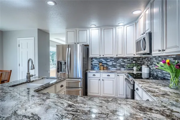 a living room with fireplace furniture and a fireplace