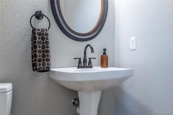 a view of living room with furniture and wall clock